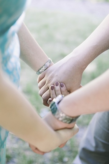 Couple-holding-both-hands-medium